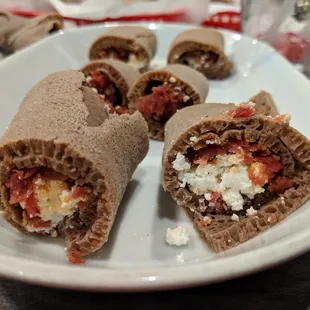 Regular kitfo. Raw ground beef with herbal butter, mitmita, and Abol seasonings served with cottage cheese. $12.99.