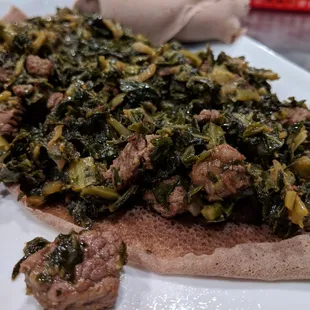 Gomen (collard greens) mixed with beef tibs and seasoned with Abol spices. $11.99.