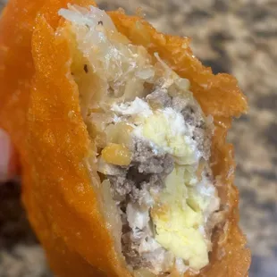 Inside of Ilocano empanada (ground pork, egg, and pickled papaya)