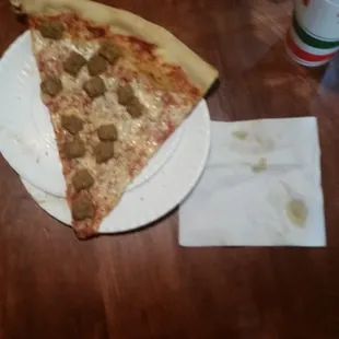 Massive slice of pizza from Abo&apos;s pizza. (Napkin for scale, sorry... I didn&apos;t have a banana.)