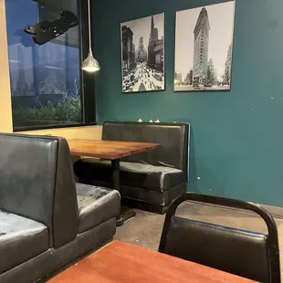 Worn benches, paint missing from the wall