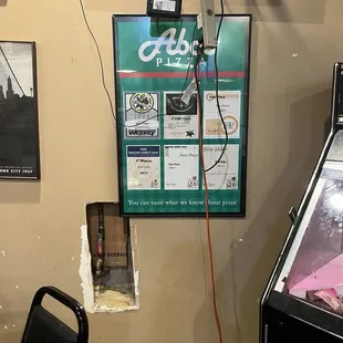 Cords hanging and a hole in the wall