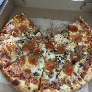 A medium $30 pizza with hardly any of the 4 toppings I ordered.