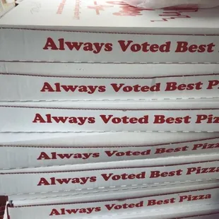 a stack of boxes of pizza