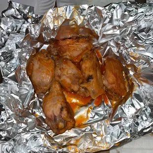 chicken wings wrapped in tin foil