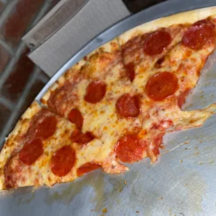 a slice of pepperoni pizza