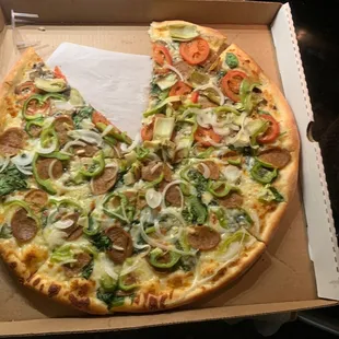 a half eaten pizza in a box