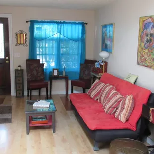 Front House sitting area with sofa bed and TV