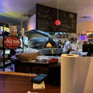 a pizza oven in the background