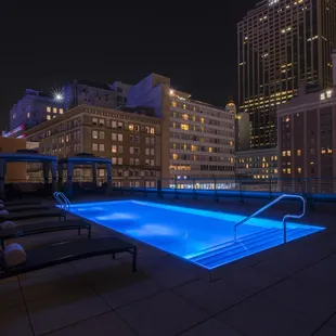 a swimming pool and lounge chairs