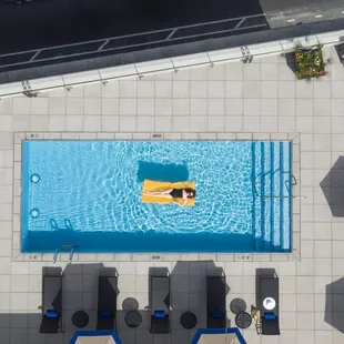 a pool and lounge chairs