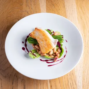 a plate of food on a wooden table