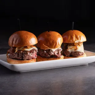 three burgers on a plate