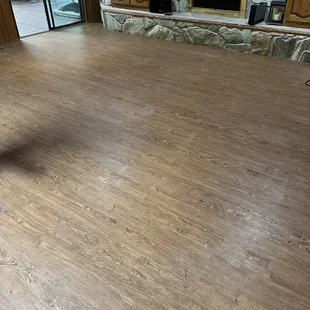 a living room with wood floors