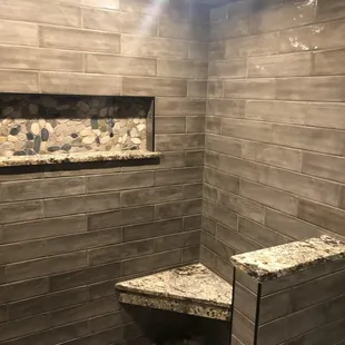 look at this bathroom remodel! custom floating bench and nicho