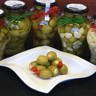 Our new line of Olives. These are absolutely the best. Chile stuffed, Garlic stuffed, Almond stuffed, Garlic and Rosemary unpitted olives.