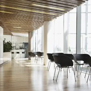 a long room with chairs and tables