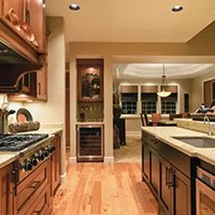 a kitchen with wood cabinets