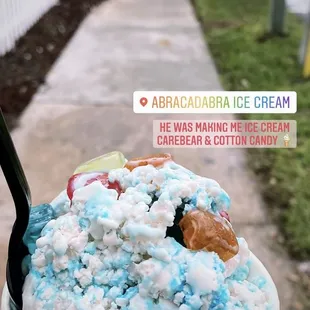 a person holding a cup of ice cream