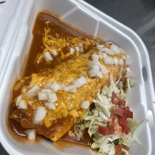 two enchillas in a styrofoam container