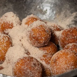 sugar coated doughnuts in a bowl
