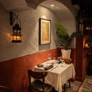 a dining room with a table and chairs