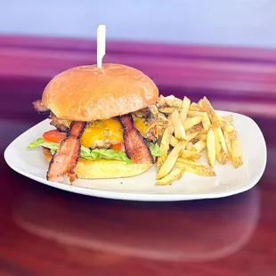 Grilled chicken sandwich with bacon, smoked cheddar cheese, lettuce, tomato, pickle and onion, with a spicy remoulade.