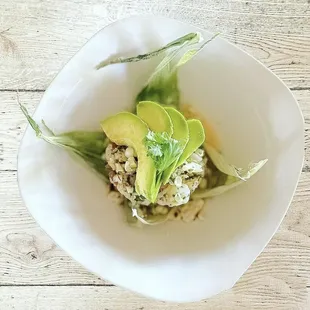 Shrimp ceviche with roasted corn, avocado, persian cucumber and chili oil.