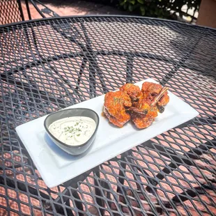 Southwest Spicy Chicken Lollipops. Served with choice of Ranch or Blue Cheese. Also offered in Honey Garlic and BBQ.