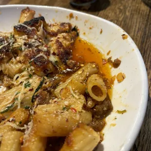 Excessive grease accumulation in the rigatoni with meat dish.