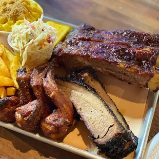 a plate of ribs and sides