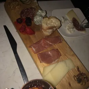 Charcuterie board. Too much blue cheese, but tasty! (A little Brie would be nice)