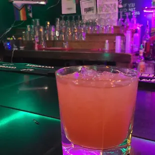 a drink in a glass on a bar