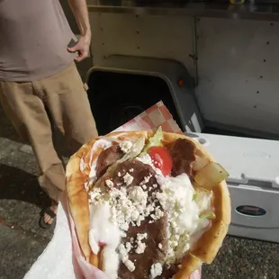 a man standing in front of a food truck