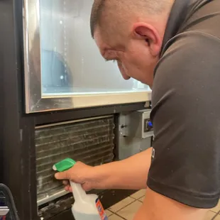 Roman giving free conderser cleaning.