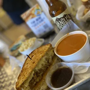 a grilled cheese sandwich with dipping sauce