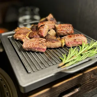 45 Day Camembert Cheese Aged Ribeye - grilled, cut, and placed on a warmer by our server