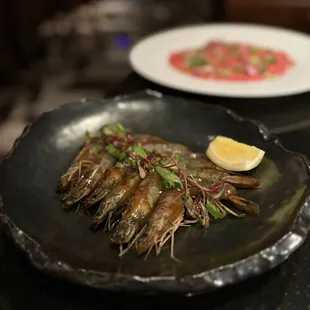 Saewoo Jang: Soy marinated prawns w/ garlic, jalapeño, lemon, sesame seeds (6 pc - $32)