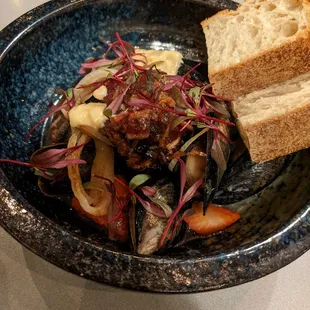Sake poached mussels with strawberries and bacon jam