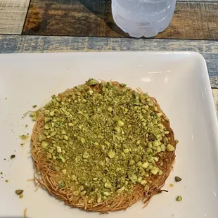 a plate of food on a wooden table