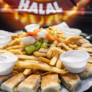 a platter of fries and dips