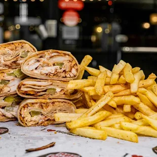 a pile of fries and a sandwich