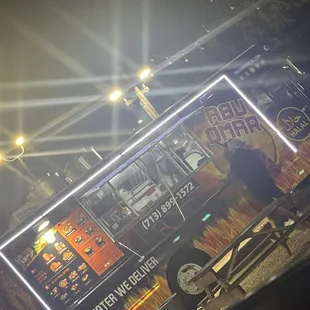 a food truck parked on the side of the road