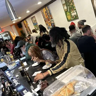 people eating and drinking