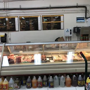 a display of meat and drinks