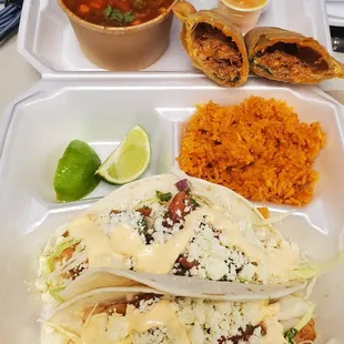 Chicken burria empanada, spicy shrimp tacos, and rice.   ...absolutely delicious as always.