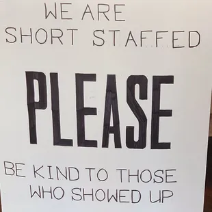 a sign that reads, we are short staff fed please be kind to those who showed