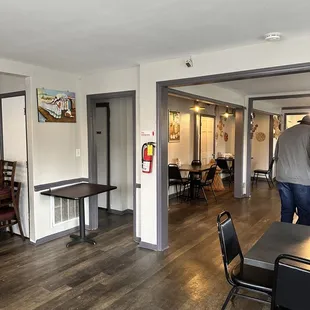 a man walking through the dining room