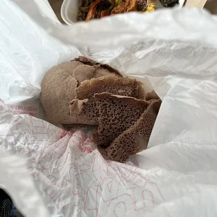 Gluten free side order of Injera not sanitary, came in a plastic bag