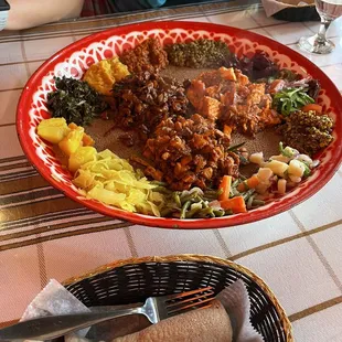 Fish, vegetables, beef tibs, chicken tibs, injera